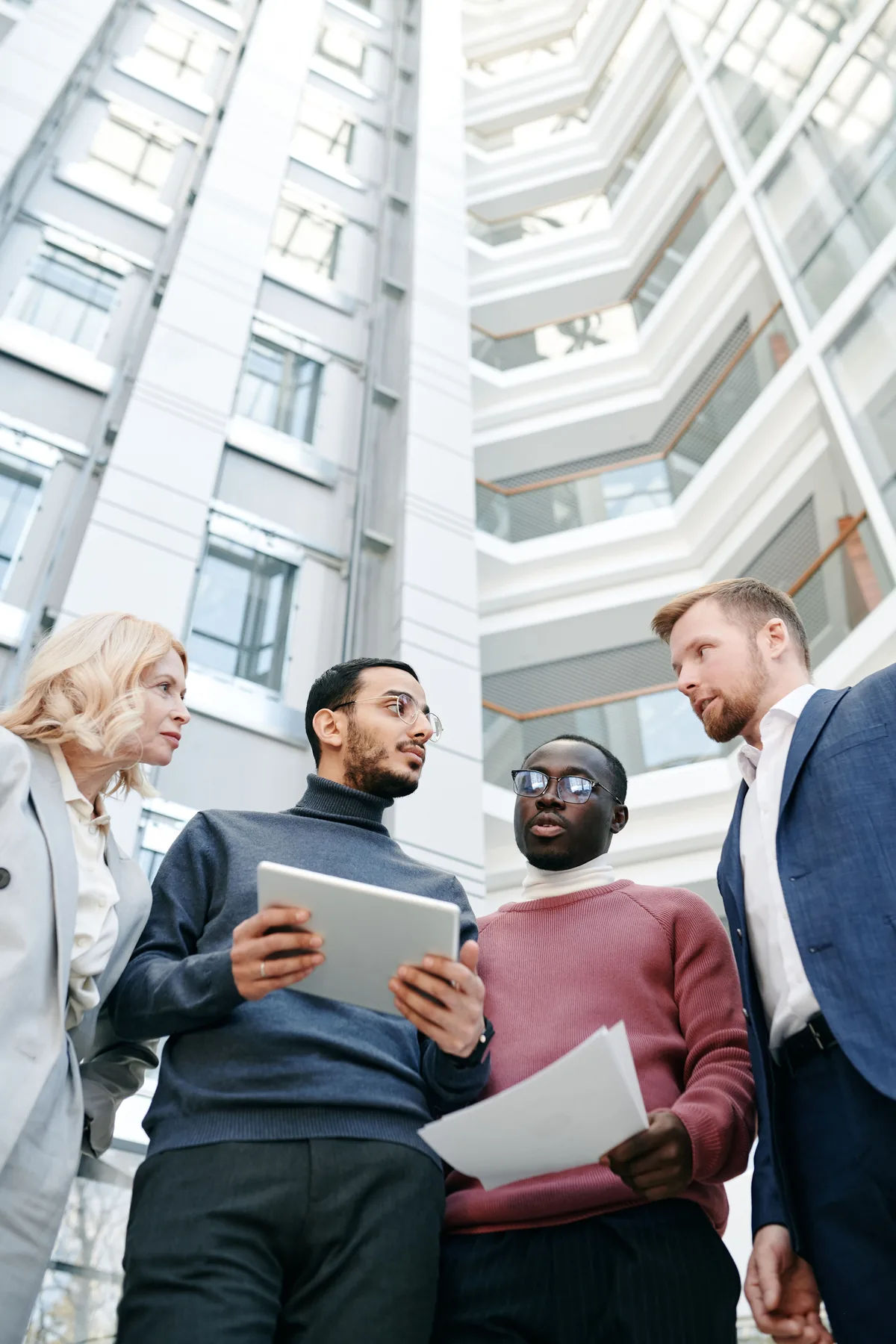four working professionals in conversation